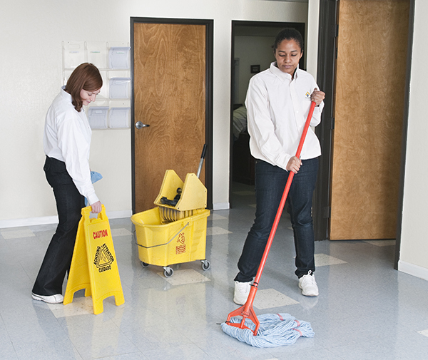 Women Cleaning Office Floor - Janitorial Services